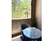 Private balcony with outdoor table and chairs, ideal for enjoying fresh air at 9600 N 96Th St # 267, Scottsdale, AZ 85259