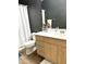 Functional bathroom with a single sink vanity, a toilet, and a shower with curtain at 9600 N 96Th St # 267, Scottsdale, AZ 85259