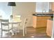 Bright dining area featuring a round table with chairs and a view into the kitchen at 9600 N 96Th St # 267, Scottsdale, AZ 85259