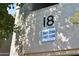 Close-up view of condo building showing unit number 18 and associated unit numbers at 9600 N 96Th St # 267, Scottsdale, AZ 85259