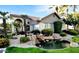 Beautiful building exterior with lush landscaping, decorative rocks, and a tranquil pond with waterfall at 9600 N 96Th St # 267, Scottsdale, AZ 85259