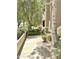 Beautifully landscaped walkway leads to the building entrance, enhancing curb appeal at 9600 N 96Th St # 267, Scottsdale, AZ 85259