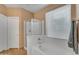Bright bathroom featuring a garden tub and separate glass enclosed shower at 9702 E Naranja Ave, Mesa, AZ 85209