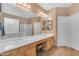 Bright primary bathroom with double sinks, soaking tub, and separate shower at 9702 E Naranja Ave, Mesa, AZ 85209