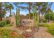 Augusta Ranch community entrance sign surrounded by desert landscaping and lush greenery at 9702 E Naranja Ave, Mesa, AZ 85209