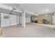Spacious three-car garage with epoxy flooring, providing ample storage and workspace for vehicles and projects at 9702 E Naranja Ave, Mesa, AZ 85209