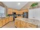 Spacious kitchen with a granite island, stainless steel appliances, and lots of storage space at 9702 E Naranja Ave, Mesa, AZ 85209