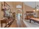 Elegant living room with vaulted ceilings, hardwood floors, and a billiards table at 9702 E Naranja Ave, Mesa, AZ 85209