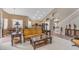 Open living room with hardwood floors, traditional furnishings, and easy access to the kitchen at 9702 E Naranja Ave, Mesa, AZ 85209