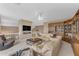 Cozy Living room featuring comfortable seating, built ins and a large flat screen tv at 9702 E Naranja Ave, Mesa, AZ 85209