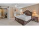 Large bedroom with neutral walls, ceiling fan, and en suite bath at 9702 E Naranja Ave, Mesa, AZ 85209
