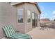 Private outdoor patio with seating and a lounge chair offering an inviting space to relax at 9702 E Naranja Ave, Mesa, AZ 85209