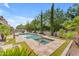 Inviting backyard pool and spa with manicured landscaping, offering a relaxing and private outdoor retreat at 9702 E Naranja Ave, Mesa, AZ 85209