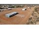 Aerial view of a new home in a rural neighborhood with a 'For Sale' sign at 10150 E Shallow Canyon Rd, San Tan Valley, AZ 85143