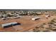 Aerial view of three homes in a rural neighborhood on large plots of land at 10150 E Shallow Canyon Rd, San Tan Valley, AZ 85143