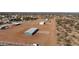 Aerial view of three homes in a rural neighborhood on large plots of land at 10150 E Shallow Canyon Rd, San Tan Valley, AZ 85143