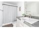 Bathroom showcasing a sink, mirror, and shower with white walls at 10150 E Shallow Canyon Rd, San Tan Valley, AZ 85143
