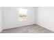 Light, bright bedroom with neutral carpet, window and white walls at 10150 E Shallow Canyon Rd, San Tan Valley, AZ 85143