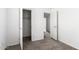 Bedroom showcasing neutral carpet and two open doors at 10150 E Shallow Canyon Rd, San Tan Valley, AZ 85143