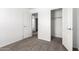 Bedroom showcasing neutral carpet and white walls with two doors at 10150 E Shallow Canyon Rd, San Tan Valley, AZ 85143