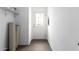 Bright entryway featuring wood-look floors, a white door with glass panes, and a convenient storage shelf at 10150 E Shallow Canyon Rd, San Tan Valley, AZ 85143