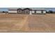 A cozy single-story home boasting a simple exterior design and a clean, gravel-covered front yard leading to the entrance at 10150 E Shallow Canyon Rd, San Tan Valley, AZ 85143