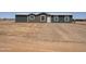Inviting single-story home showcasing a simple facade with a mix of siding and a neatly landscaped front yard at 10150 E Shallow Canyon Rd, San Tan Valley, AZ 85143