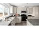 Functional kitchen with stainless steel appliances, ample countertops, and bright lighting at 10150 E Shallow Canyon Rd, San Tan Valley, AZ 85143