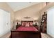 Comfortable bedroom with neutral walls, stylish decor, and vaulted ceiling at 10301 N 70Th St # 223, Paradise Valley, AZ 85253