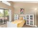 Cozy bedroom featuring natural light, access to balcony, and built-in shelving at 10301 N 70Th St # 223, Paradise Valley, AZ 85253