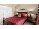 Comfortable bedroom featuring neutral walls, stylish decor, and vaulted ceiling at 10301 N 70Th St # 223, Paradise Valley, AZ 85253