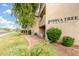 A Joshua Tree residential building exterior view with shrubbery and ground cover landscaping and green grass at 10301 N 70Th St # 223, Paradise Valley, AZ 85253