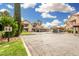 A wide shot of the parking area in front of multi-unit residential buildings with covered parking spots at 10301 N 70Th St # 223, Paradise Valley, AZ 85253