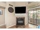 Modern fireplace with stylish tile surround and sleek design, perfect for cozy evenings at 10301 N 70Th St # 223, Paradise Valley, AZ 85253