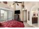Spacious main bedroom featuring balcony access, high ceilings, and ensuite bathroom at 10301 N 70Th St # 223, Paradise Valley, AZ 85253