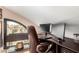 Office space featuring a large window, comfortable chair, and built-in desk at 10301 N 70Th St # 223, Paradise Valley, AZ 85253