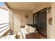 Private patio with comfortable seating, a textured wall, and sliding glass doors at 10301 N 70Th St # 223, Paradise Valley, AZ 85253