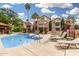 Sparkling community pool features lounge chairs, lush landscaping, and clear blue skies at 10301 N 70Th St # 223, Paradise Valley, AZ 85253