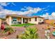 Well-maintained backyard with artificial grass, desert landscaping, and comfortable patio furniture, creating an inviting outdoor space at 10545 E Texas Ave, Mesa, AZ 85212