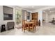 Cozy dining area with natural light, backyard access, and rustic wooden furniture at 10545 E Texas Ave, Mesa, AZ 85212