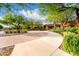 Elegant building entrance featuring lush landscaping, and beautiful architecture at 10545 E Texas Ave, Mesa, AZ 85212
