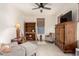Comfortable living room with gray chairs, a wood cabinet, and natural light at 10545 E Texas Ave, Mesa, AZ 85212