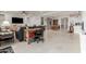 Expansive living room featuring tile flooring and a seamless transition to the kitchen and dining areas at 10545 E Texas Ave, Mesa, AZ 85212