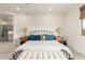 Bright and serene main bedroom featuring a sitting area, tiled floors, and ensuite bathroom access at 10545 E Texas Ave, Mesa, AZ 85212