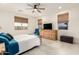 Cozy main bedroom with tile floors, a ceiling fan, and generous natural light at 10545 E Texas Ave, Mesa, AZ 85212