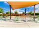 Charming outdoor seating area surrounded by vibrant landscaping and flowering plants perfect for relaxation at 10545 E Texas Ave, Mesa, AZ 85212