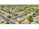Expansive aerial view of a well-planned community with lush green spaces and a variety of single-Gathering homes with pools at 10760 W Encanto Blvd, Avondale, AZ 85392