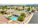 Aerial view featuring a private backyard oasis with a glistening pool, landscaped areas, and a charming patio, perfect for relaxing at 10760 W Encanto Blvd, Avondale, AZ 85392
