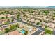 Extensive aerial shot displaying a residential neighborhood with diverse housing, lush landscaping, and well-maintained streets with sidewalks at 10760 W Encanto Blvd, Avondale, AZ 85392
