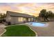 Backyard featuring a refreshing pool, tasteful landscaping, and an extended patio space, ideal for entertaining and relaxation at 10760 W Encanto Blvd, Avondale, AZ 85392